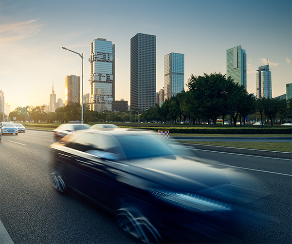 Cars Traveling blurred cityscape